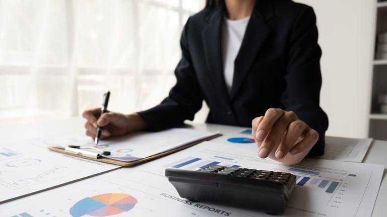 Business owner reviewing a cash flow forecast for the final quarter of the year