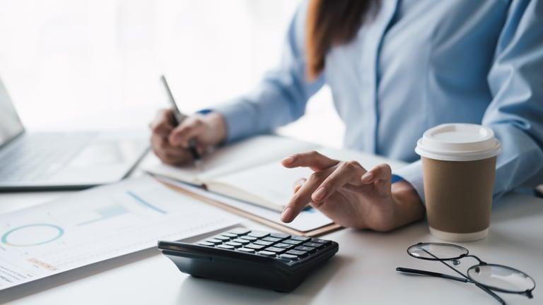 Business owner reviewing how much to set aside in a cash reserve
