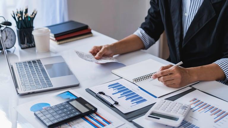 Self-employed business owner reviewing their July payment on account tax bill