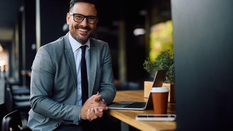 Sole trader using accounting software on a laptop for Making Tax Digital quarterly updates